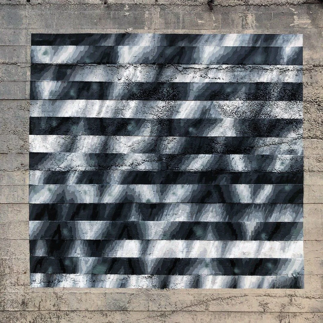 Tangible Noise: black-and-white optical stripes on a concrete wall