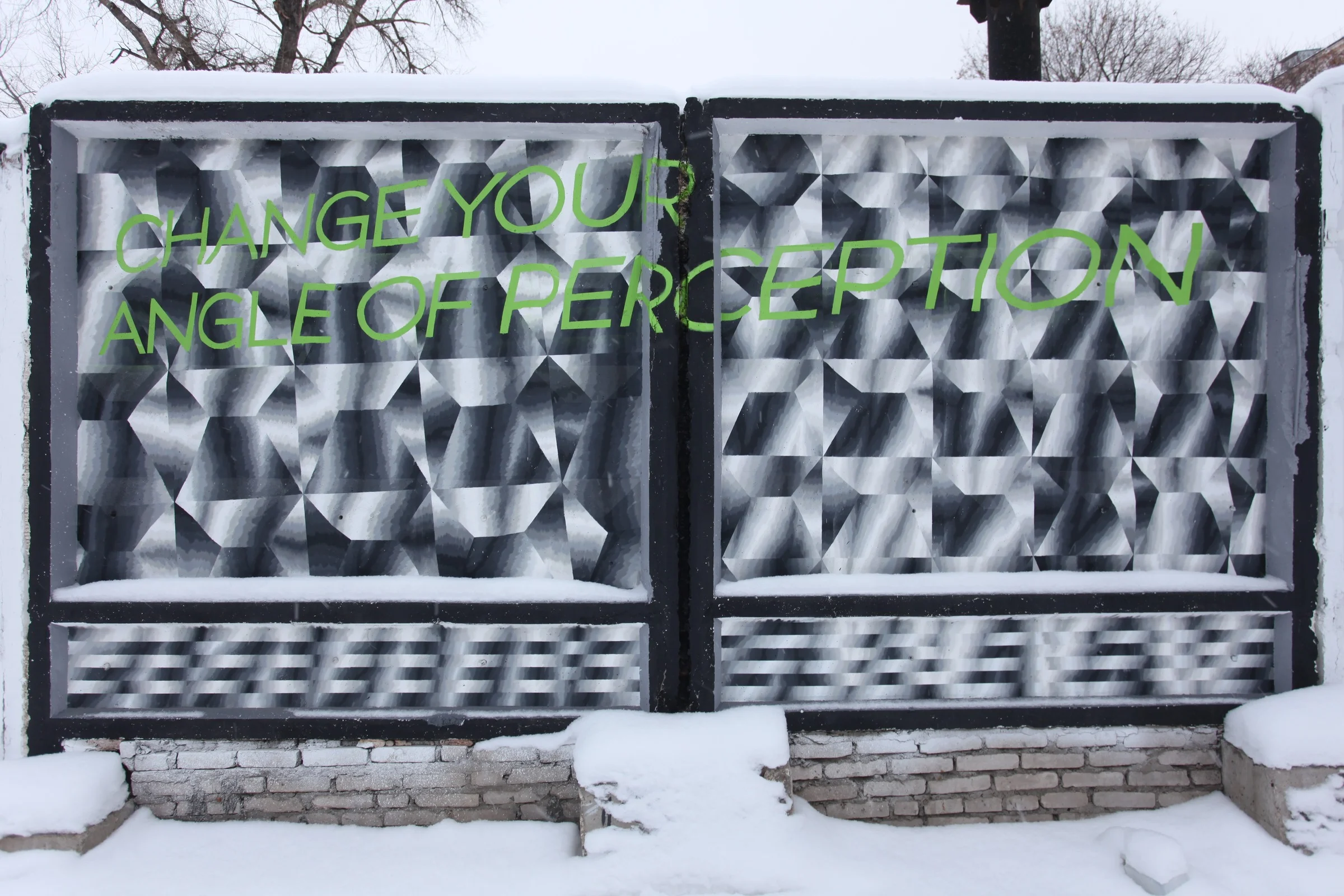 Stereotype Destroyer: optical pattern on a Soviet PO-2 concrete fence, with the words Change your angle of perception